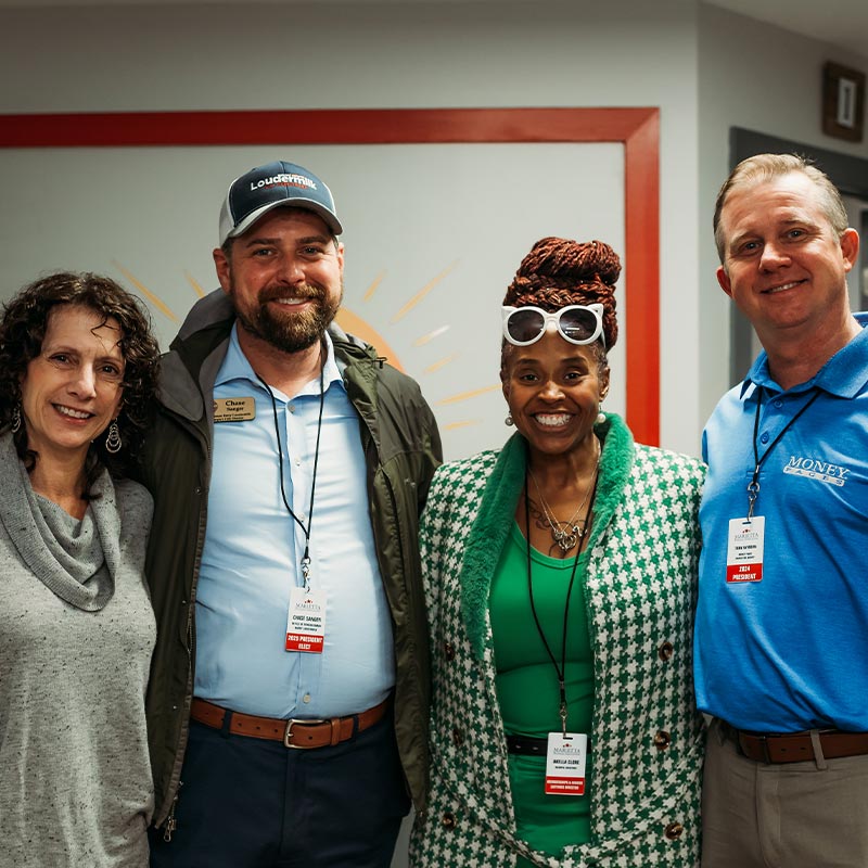 Staff Members Posing At Ribbon Cutting Ceremony