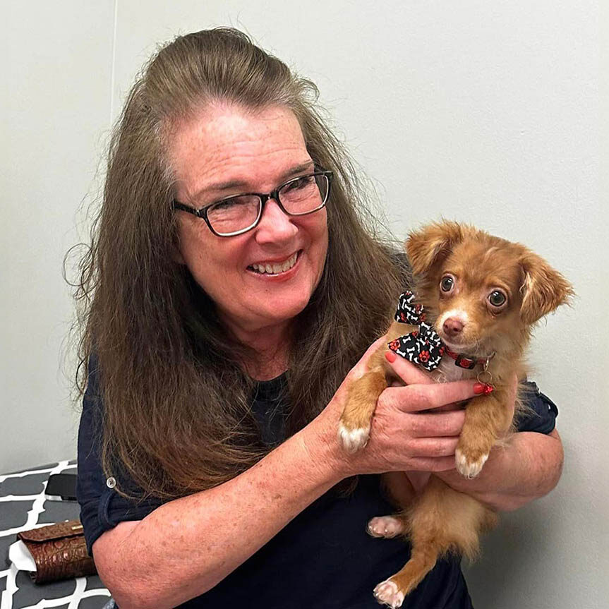 client holding puppy during pet wellness exam in marietta ga